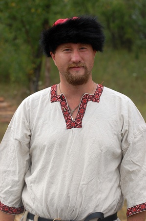 KIEV, UKRAINE - JULY 31: Member of history club Golden Capricorn wears medieval costume as he participates in historical festival and camp in memory of King Vladimir July 31, 2009 in Kiev, Ukraine.のeditorial素材