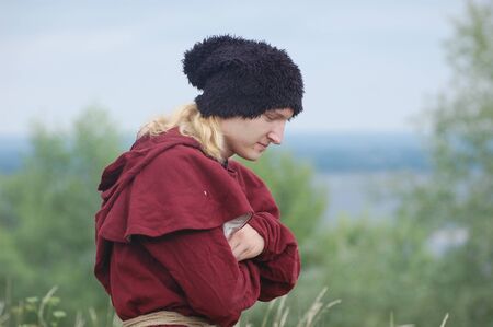 KIEV, UKRAINE - JULY 31: Member of history club Golden Capricorn wears medieval costume as he participates in historical festival and camp in memory of King Vladimir July 31, 2009 in Kiev, Ukraine. のeditorial素材