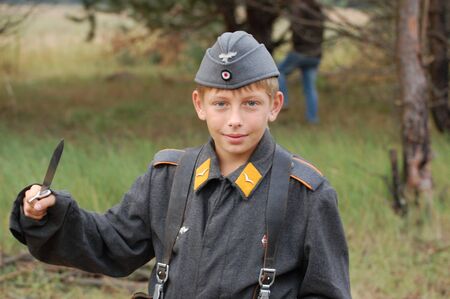 CHERNIGOW, UKRAINE - AUG 29: Member of Red Star military history club wears historical German uniform during historical reenactment of WWII, August 29, 2010 in Chernigow, Ukraine のeditorial素材