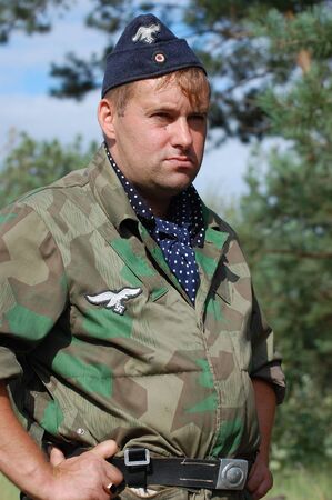 CHERNIGOW, UKRAINE - AUG 29: Member of Red Star military history club wears historical German...
