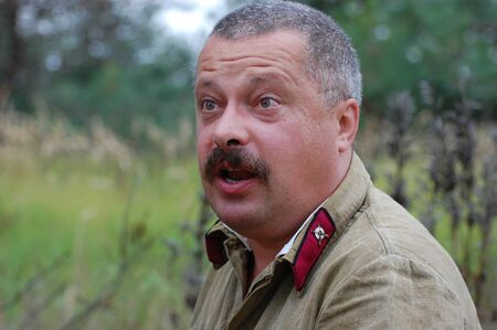 CHERNIGOW, UKRAINE - AUG 29: A member of Red Star military history club wears historical Soviet uniform during historical reenactment of WWII, August 29, 2010 in Chernigow, Ukraine のeditorial素材