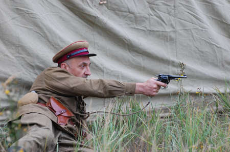 CHERNIGOW, UKRAINE - AUG 29: A member of Red Star military history club wears historical Soviet uniform during historical reenactment of WWII, August 29, 2010 in Chernigow, Ukraine のeditorial素材