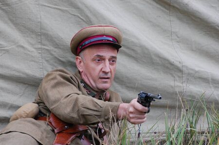 CHERNIGOW, UKRAINE - AUG 29: A member of Red Star military history club wears historical Soviet uniform during historical reenactment of WWII, August 29, 2010 in Chernigow, Ukraine のeditorial素材