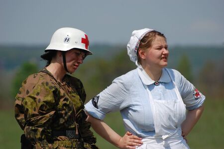 KIEV, UKRAINE - MAY 10 : members of Red Star history club wear historical military German paramedic uniform during historical reenactment of 1945 WWII, May 10, 2010 in Kiev, Ukraine のeditorial素材