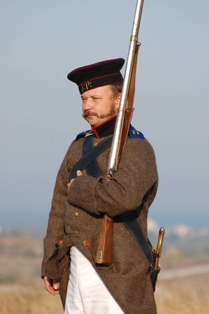 CRIMEA, UKRAINE - SEPTEMBER 26: Member of military history club ALMA wears Russian historical uniform during historical reenactment of Crimean War September 26, 2009 , Crimea, Ukraine のeditorial素材