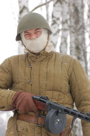 KIEV, UKRAINE - FEB 20: A member of military history club Red Star wears historical Soviet uniform during historical reenactment of WWII,February 20, 2011 in Kiev, Ukraineのeditorial素材