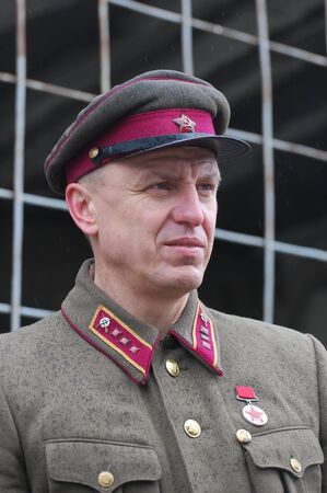 KIEV, UKRAINE - MAY 6 : A member of Red Star history club wears historical Soviet uniform during historical reenactment of WWII, May 6, 2011 in Kiev, Ukraine のeditorial素材