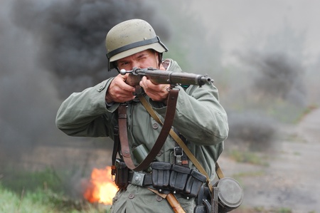 KIEV, UKRAINE - MAY 6 : Member of Red Star history club wears historical German uniform during historical reenactment of WWII, May 6, 2011 in Kiev, Ukraine のeditorial素材