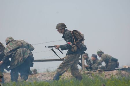 KIEV, UKRAINE - MAY 8 : Member of Red Star history club wears historical German uniform during historical reenactment of WWII on May 8, 2011 in Kiev, Ukraine のeditorial素材