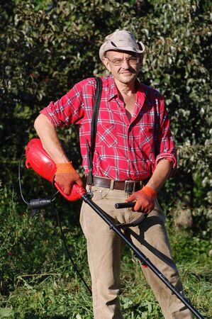 Man mowing grass.Ukraineの写真素材