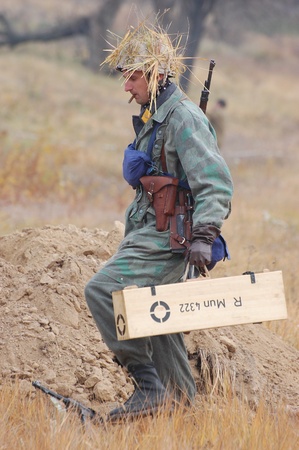 KIEV, UKRAINE -NOV 6: Unidentified member of Red Star history club wears historical German paratrooper uniform during historical reenactment of WWII, November 6, 2011 in Kiev, Ukraine のeditorial素材