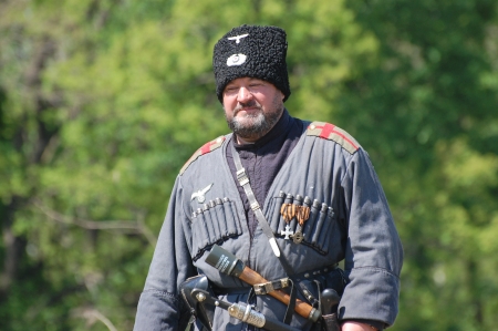 KIEV, UKRAINE -MAY 11: Member of Red Star history club wears historical uniform cossack of Corps von Panvits (German) during historical reenactment of WWII, May 11, 2013 in Kiev, Ukraineのeditorial素材