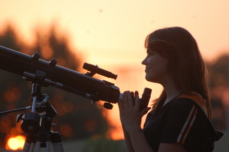 Teen girl and telescope  Near Kiev,Ukraineの写真素材