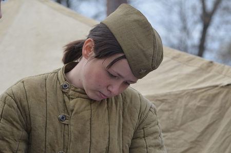 KIEV, UKRAINE -NOV 1  An unidentified member of Red Star history club wears historical Soviet uniform during historical reenactment of WWII, Battle for Kiev 1943 on November 1, 2013 in Kiev, Ukraineのeditorial素材
