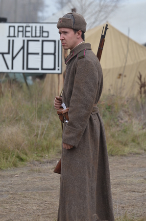 KIEV, UKRAINE -NOV 1  An unidentified member of Red Star history club wears historical Soviet uniform during historical reenactment of WWII, Battle for Kiev 1943 on November 1, 2013 in Kiev, Ukraineのeditorial素材
