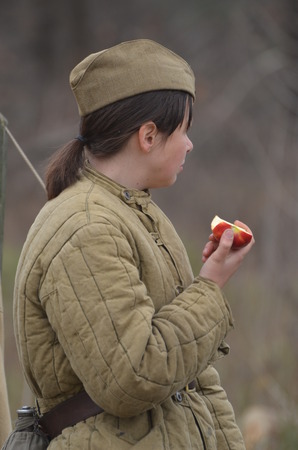 KIEV, UKRAINE -NOV 1  An unidentified member of Red Star history club wears historical Soviet uniform during historical reenactment of WWII, Battle for Kiev 1943 on November 1, 2013 in Kiev, Ukraineのeditorial素材