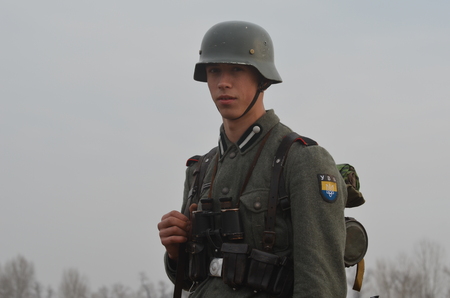KIEV, UKRAINE -NOV 3   An unidentified members of Red Star history club wear historical German uniform during historical reenactment of WWII, Dnepr river crossing 1943, November 3, 2013  Kiev, Ukraineのeditorial素材