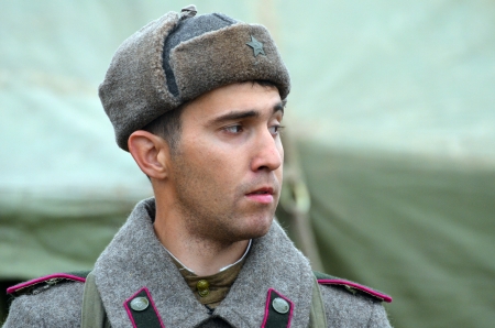KIEV, UKRAINE -NOV 3 An unidentified member of Red Star history club wears historical Soviet uniform during historical reenactment of WWII, Battle for Kiev 1943 on November 3, 2013 in Kiev, Ukraine のeditorial素材