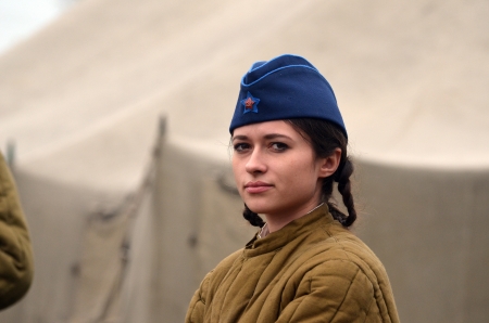 KIEV, UKRAINE -NOV 3 An unidentified member of Red Star history club wears historical Soviet uniform during historical reenactment of WWII, Battle for Kiev 1943 on November 3, 2013 in Kiev, Ukraine のeditorial素材