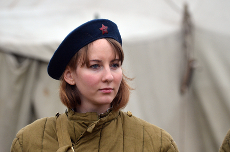 KIEV, UKRAINE -NOV 3 An unidentified member of Red Star history club wears historical Soviet uniform during historical reenactment of WWII, Battle for Kiev 1943 on November 3, 2013 in Kiev, Ukraine のeditorial素材