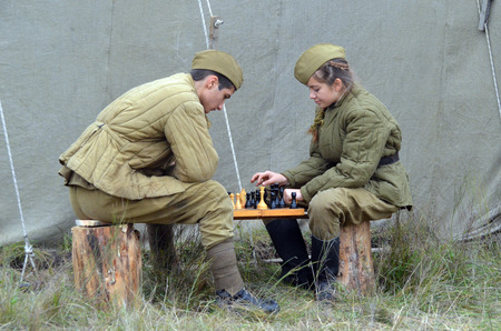 KIEV, UKRAINE -NOV 3 An unidentified members of Red Star history club wear historical Soviet uniform during historical reenactment of WWII, Dnepr river crossing 1943, November 3, 2013 Kiev, Ukraine のeditorial素材