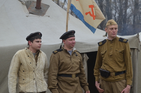 KIEV, UKRAINE -NOV 3 An unidentified members of Red Star history club wear historical Soviet uniform during historical reenactment of WWII, Dnepr river crossing 1943, November 3, 2013 Kiev, Ukraine のeditorial素材