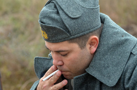 KIEV, UKRAINE -NOV 2 An unidentified member of Red Star history club wears historical Italian uniform during historical reenactment of WWII, Battle for Kiev 1943 on November 2, 2013 in Kiev, Ukraine のeditorial素材