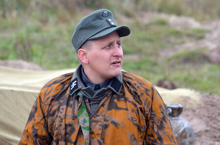 KIEV, UKRAINE -NOV 3  An unidentified member of Red Star history club wears historical German uniform during historical reenactment of WWII, Dnepr river crossing 1943, November 3, 2013  Kiev, Ukraineのeditorial素材
