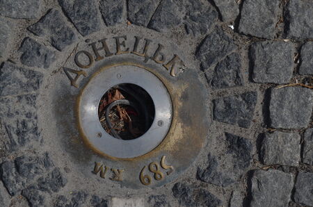 KIEV, UKRAINE - AUGUST 24, 2014. Bronze lanterns with names of Ukrainian cities  in the cover of street ,vandalised during revolution of dignity and occupation Kiev by peasants from Western Ukraine.のeditorial素材