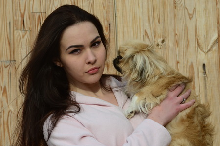 Teen girl with small dog.Near Kiev,Ukraineの写真素材
