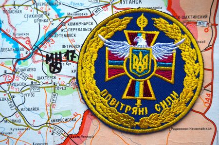 Illustrative editorial.Chevron of Ukrainian air force. Estern Ukraine map with site MH-17 flight crush as background. At January 10,2015 in Kiev, Ukraineのeditorial素材