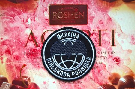 Illustrative editorial. Military secret service of Ukraine chevron.With logo Roshen Inc. Trademark...