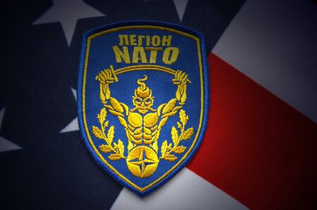 Ukrainian military chevron. With US Flag as background.on April 162015 in Kiev Ukraine