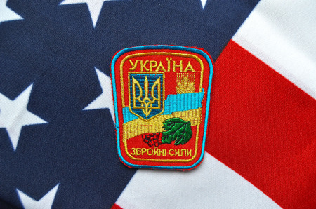 Ukrainian military chevron. With US Flag as background.on April 162015 in Kiev Ukraineのeditorial素材
