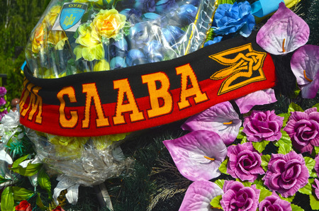 AUG13,2015 in KIEV,UKRAINE .Lesnoye Forest Cemetery.Graves of Ukrainan army and nationalist formations soldiers died during Ukrainian Civil War 2014-15 at Donbas. At August 13,2015 in Kiev,Ukraineのeditorial素材