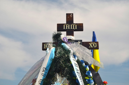 AUG13,2015 in KIEV,UKRAINE .Lesnoye Forest Cemetery.Graves of Ukrainan army and nationalist formations soldiers died during Ukrainian Civil War 2014-15 at Donbas. At August 13,2015 in Kiev,Ukraineのeditorial素材