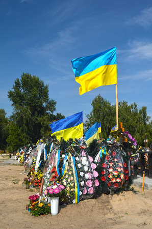 AUG13,2015 in KIEV,UKRAINE .Lesnoye Forest Cemetery.Graves of Ukrainan army and nationalist formations soldiers died during Ukrainian Civil War 2014-15 at Donbas. At August 13,2015 in Kiev,Ukraineのeditorial素材