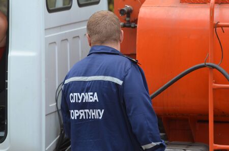 KIEV, UKRAINE - September 03, 2015: Ukrainian rescue and fireman team in the forest. A lot of fire forest near Kiev at beginning of September.のeditorial素材