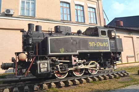 KIEV, UKRAINE - SEP 2, 2015: The monument of Soviet steam locomotive near Technical History Museum...