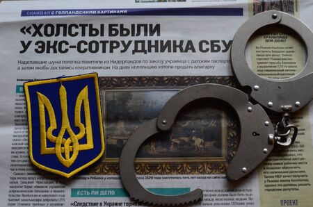 Chevron Ukrainian nazionalist battalion.Background - newspaper about West Frisian stolen art