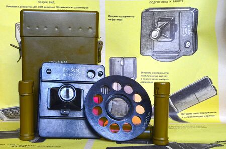 Vintage Soviet military chemical radiometer DP-70 and color of solutions compare set PK56m.Back-poster of individual radiometers DP-70 & PK56m, design and usageのeditorial素材