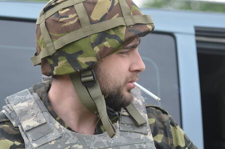 An unidentified person wears modern Ukrainian nazionalist battalion uniformのeditorial素材