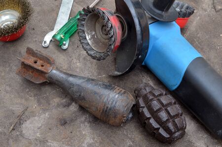 Weapon of WWII.Cleanining, deactivating and preparing to war relics collection. Found with metal detector.の写真素材