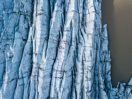 Svnafellsjkull Glacier in Iceland. Top view. Skaftafell National Park. Ice and ashes of the volcano texture landscape, beautiful nature ice background from Icelandの写真素材