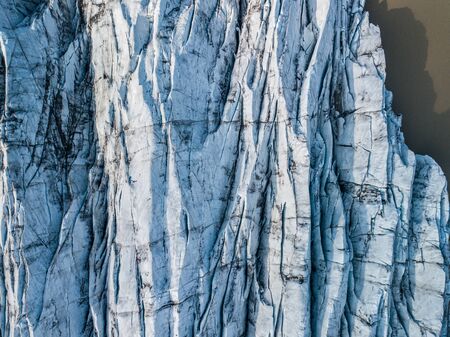 Svnafellsjkull Glacier in Iceland. Top view. Skaftafell National Park. Ice and ashes of the volcano texture landscape, beautiful nature ice background from Icelandの写真素材