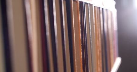 Book shelfs in library. Close up Many books organized in shelves in a big bookstoreの写真素材