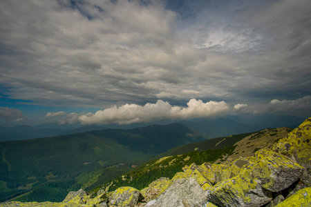 Beautiful clouds over mountains and rocks. View from the top of the mountainの写真素材