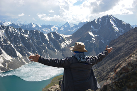 Wonderful mountain landscape and man (lake, highland, peak, beauty world) Picturesque mountain...