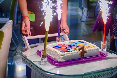 Birthday cake with bright candles. Kid party.