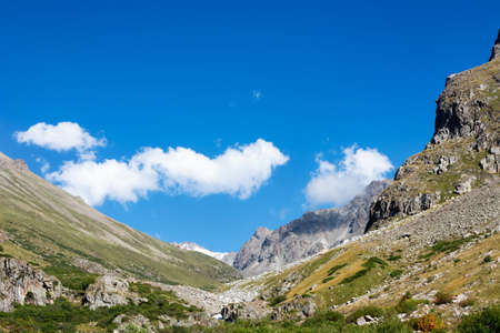 Mountain landscape view in Kyrgyzstan. Green grass in mountain valley view. Mountain panorama. Kyrgyz Alatoo mountains, Tian-Shan, Ala-archa, Kyrgyzstan.の写真素材